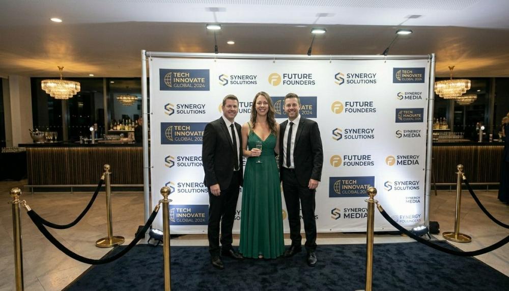 Guest perspective walking toward Step and Repeat backdrop with red carpet