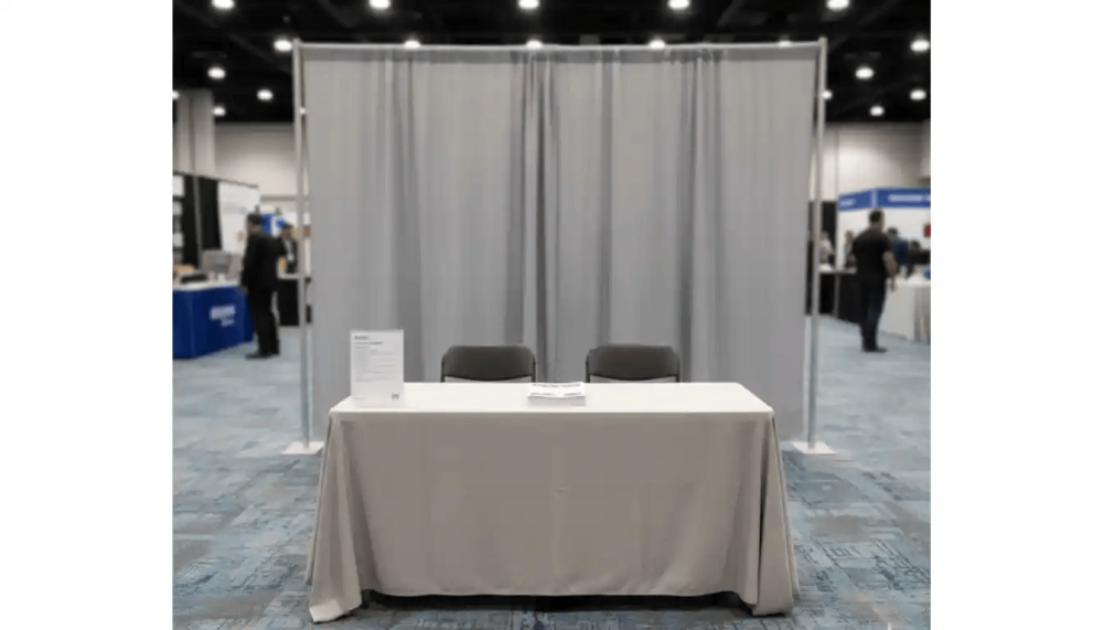 Standard trade show booth with basic table and backdrop