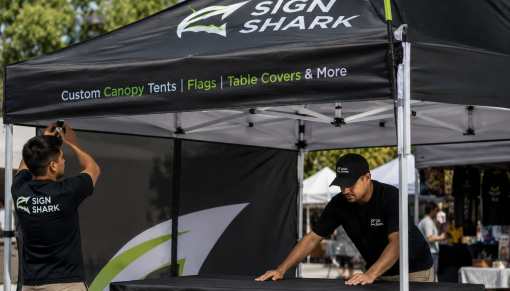 Close-up of 10x10 custom canopy tent frame and table setup